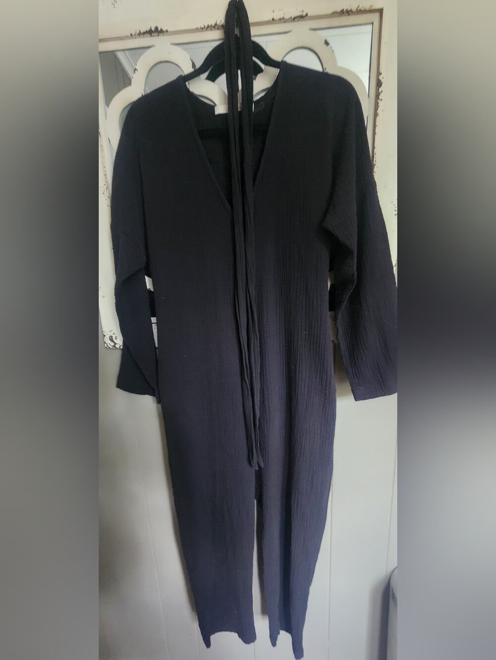 Sleek Black Ribbed V-Neck Jumpsuit with Tie Waist